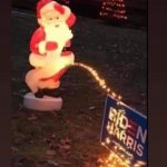 Santa pissing on Biden-Harris Sign