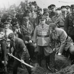 Hitler shoveling dirt