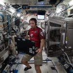 Thomas Pesquet with computer on ISS