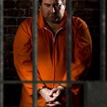 Fat Prisoner behind bars prison jail