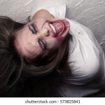 Crazy woman in straitjacket