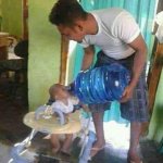 Dad Giving Baby Water