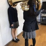 Girl with tuba on head