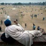 Man leisurely watching cricket