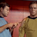 Dr McCoy giving Captain Kirk a vaccine