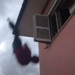 man falling out of a window