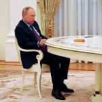 Slumped Vladimir Putin