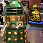Guy distracted by green Dalek