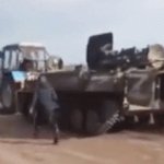 Ukrainian farmer tows Russian tank
