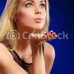 beautiful blonde woman blowing kiss