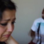 Woman crying while man dances in the background GIF Template