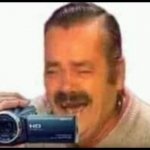 Laughing mexican man holding camera