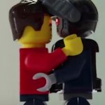 Lego man hugging a lego robot