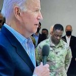 soldier gives biden a look of disgust