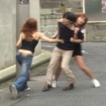 Two Asian girls beating up Asian guy