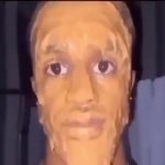 black man face covered in peanut butter looking at the camera om meme