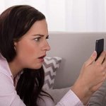 STARTLED WOMAN, WOMAN SHOCKED AT NEWS ON PHONE