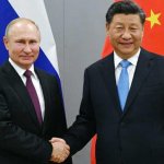 Vladimir putin and xi jinping hand shake