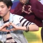 dude doing finger heart