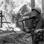 Burning huts village Vietnam