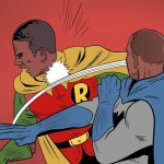 Will Smith as Batman slaps Chris Rock as Robin