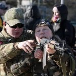 Ukrainian woman pointing rifle