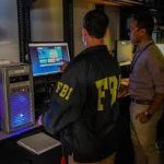 FBI agents in computer lab