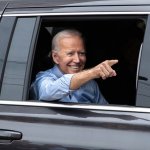 Biden points from his limo