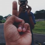 Pointing middle finger