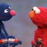 Grover and Elmo discuss trains