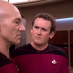 Chief O'Brien looking at Captain Picard