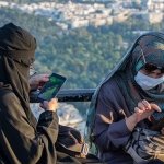 Two Muslim women burqa burka smartphones