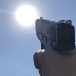 Pointing gun at the sun meme