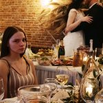 Disgruntled woman at wedding