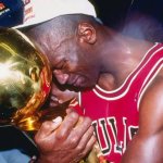 Michael Jordan hugging trophy