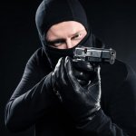 Thief pointing gun armed robber