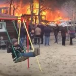 Boy swinging during house fire