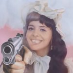Mealine Martinez with a gun