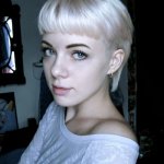 Cute young blonde girl with short bangs