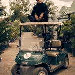 Matt Smith on a golf cart