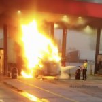 Semi truck up in flames and putting out with fire extinguisher