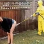 MAN PRESSURE WASHER, WOMAN BENT OVER