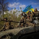 Ukrainian soldiers ride to victory