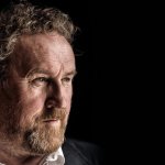 Colm Meaney (Miles O'Brien) looking pensive black background