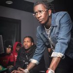 Young Thug looking at computer