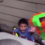 Nerf gun pointed at dramatic kid