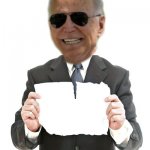 Biden holding ripped paper