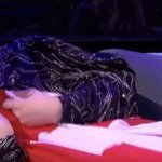 gjon going to sleep using his swiss flag as a blanket