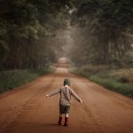 child walking on road