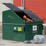 homeless man in garbage